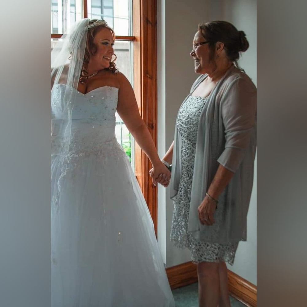 Wedding dress only worn for couple hours.  Bought new from Rosetree in Kenova.